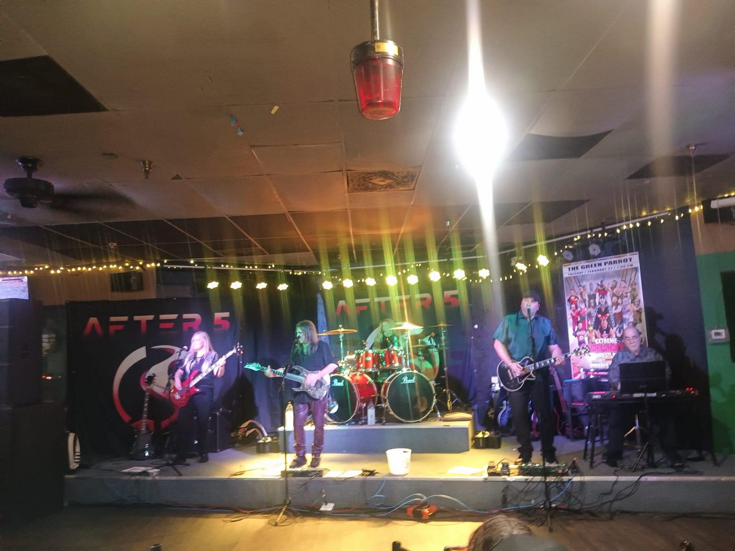 After 5 performing at an outdoor venue strung with lights