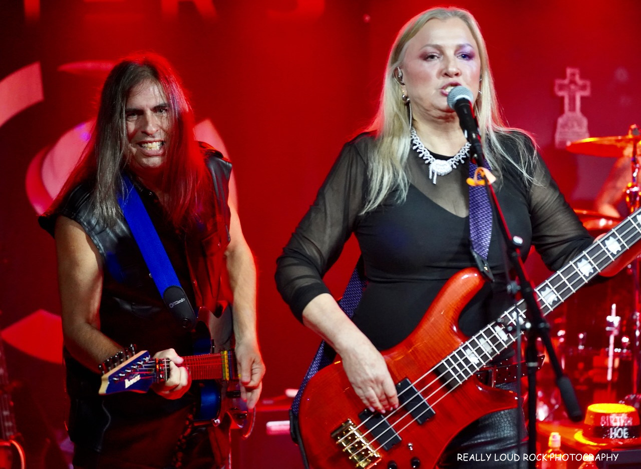 After 5's bass player and guitarist sharing the front of the stage