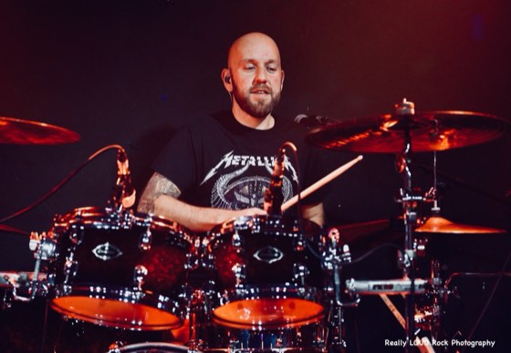 After 5's drummer mid-set behind the kit